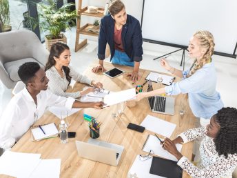 An engaging scene of brainstorming and sketching at Inorigin, showcasing innovative ideas for product design and engineering in a creative workspace environment.